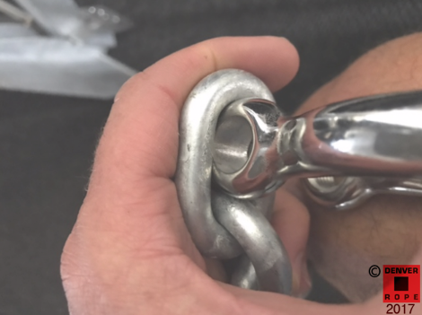 The shackle ears will not fit through the anchor chain inside width / window, but the shackle pin will. Generally, select the largest shackle pin that will fit through the inside chain window, where the rule-of-thumb is to specify the shackle diameter to be a 1/16" larger than the chain diameter.